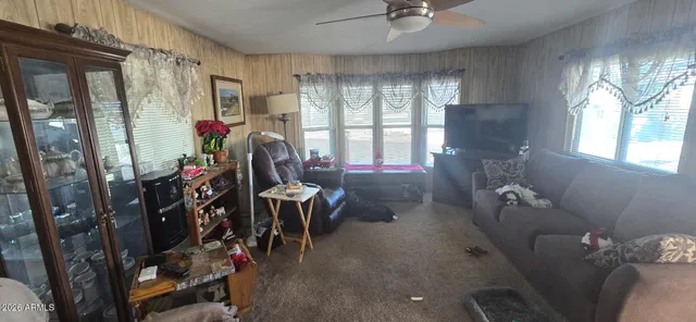 a living room with furniture and a window