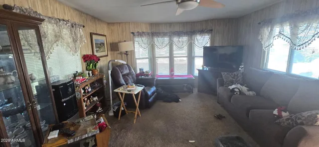 a kitchen with a refrigerator a stove a sink and a window