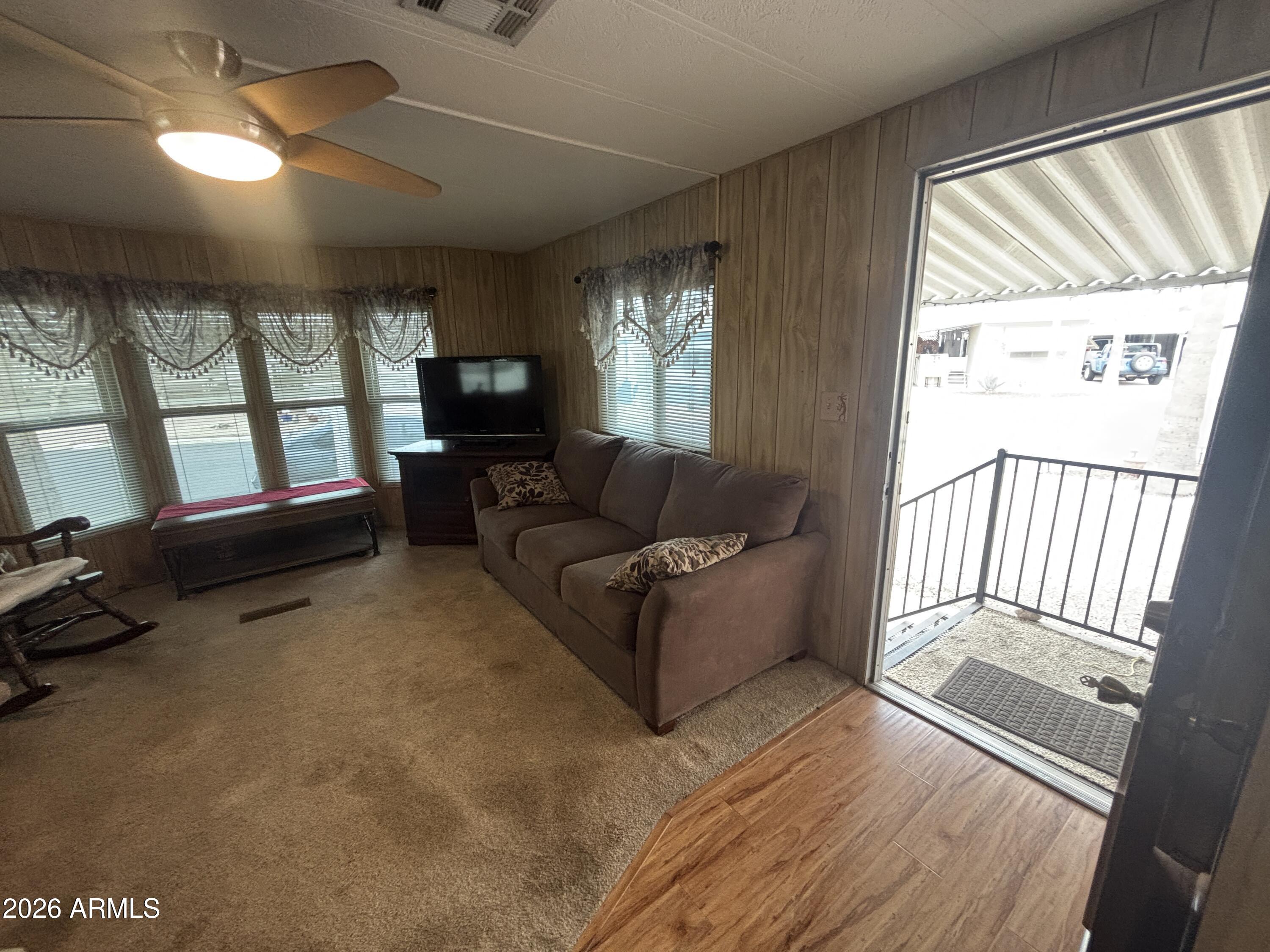 800 West Apache Trail, Unit 18 Apache Junction, AZ 85120 - Photo 9 of 24 a living room with furniture and a flat screen tv