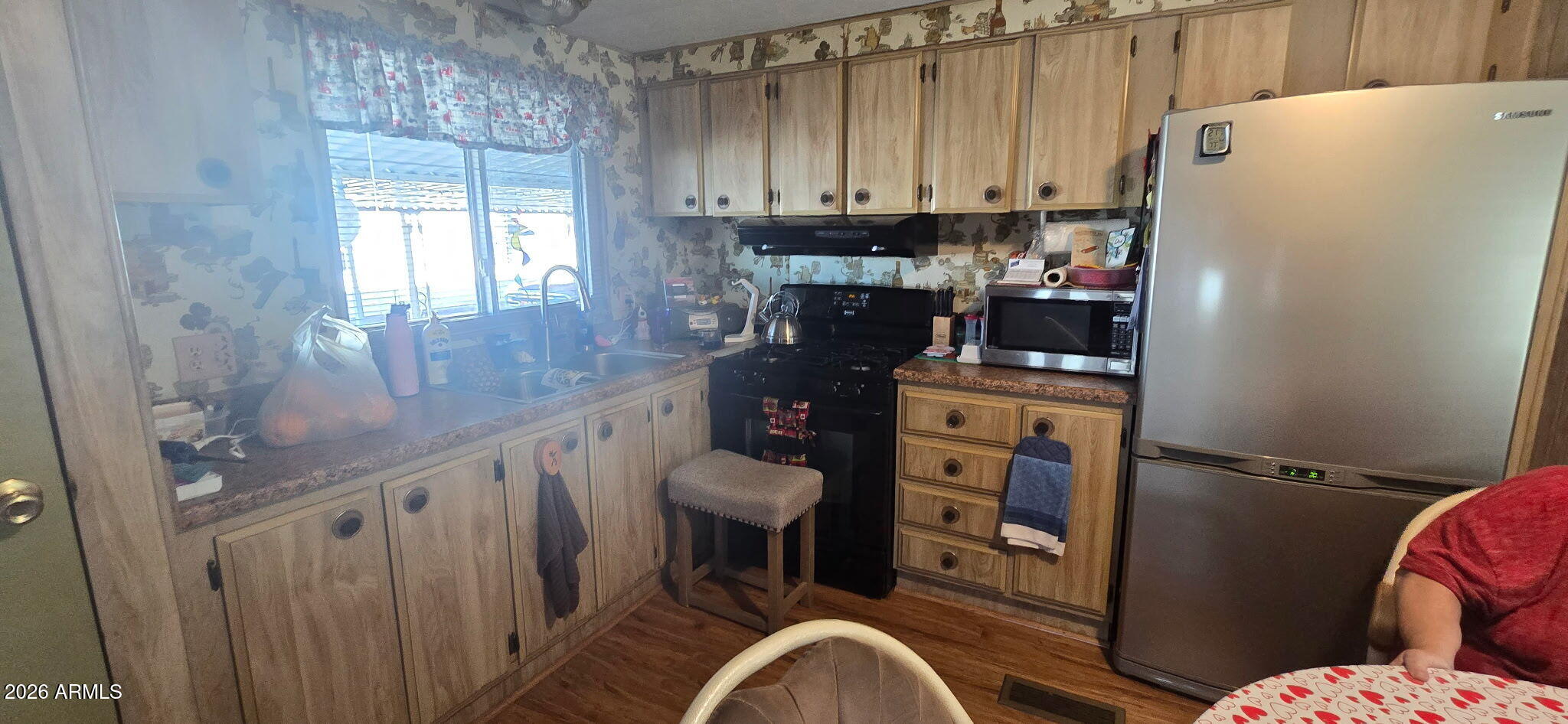 800 West Apache Trail, Unit 18 Apache Junction, AZ 85120 - Photo 10 of 20 a kitchen with a refrigerator and a stove