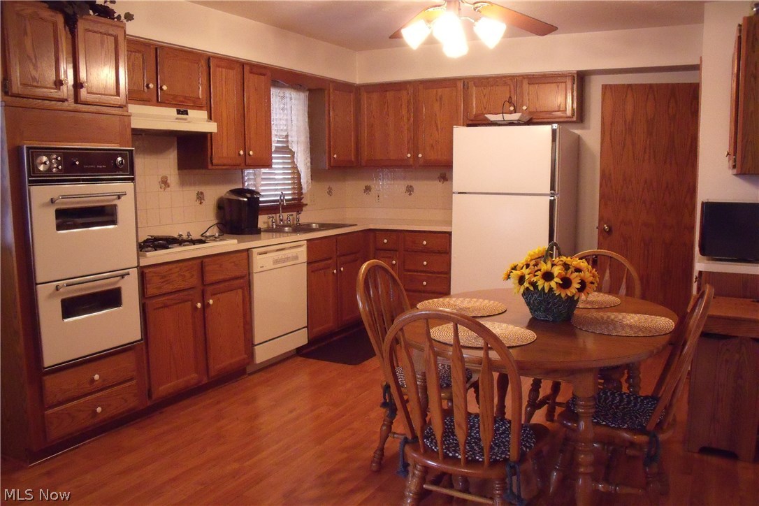 450 Orchardview Road Independence, OH 44131 - Photo 8 of 33 Large eat in kitchen with laminate floor, plenty of cabinets, appliances stay.