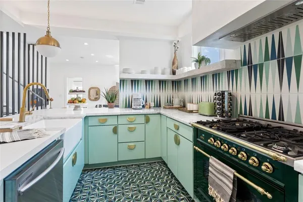 a kitchen with a stove and cabinets