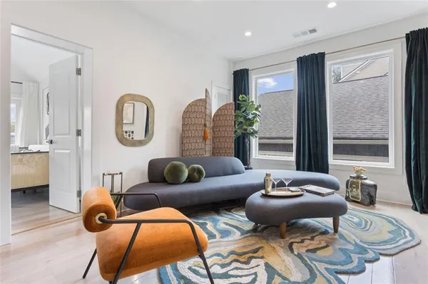 a living room with furniture and a large window
