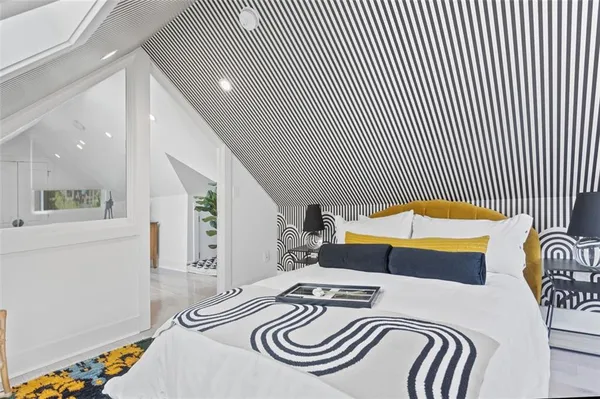 a bedroom with a bed and a table