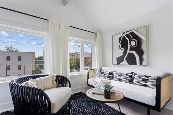 a living room with furniture and window