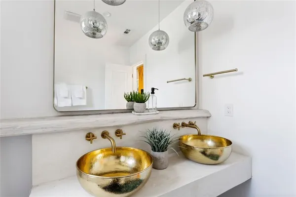 a bathroom with a sink a toilet and shower curtain