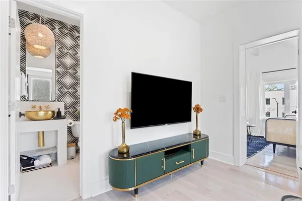 a living room with furniture and a flat screen tv