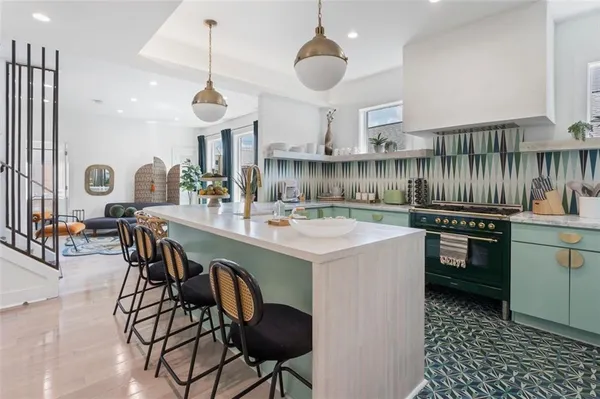 a kitchen with a dining table and chairs