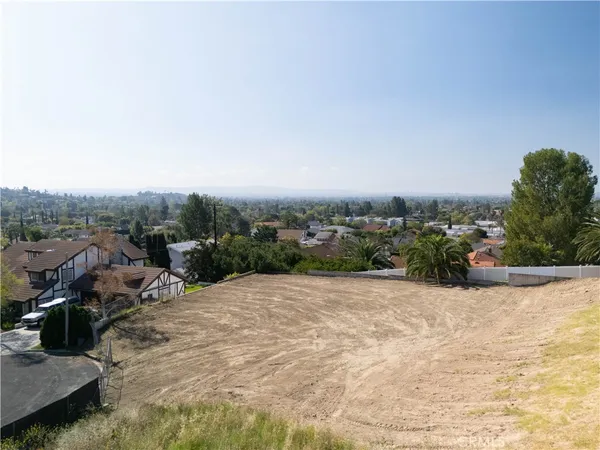 an aerial view of a house with a lake view