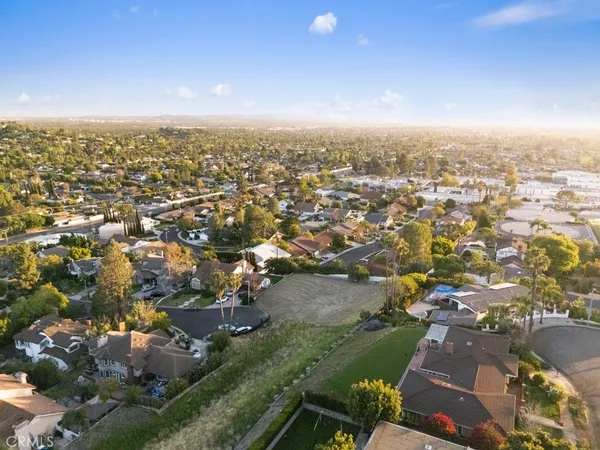 an aerial view of residential building with parking space