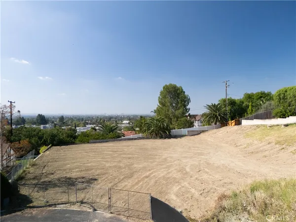 a view of a road with a building in the background