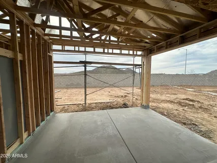 a view of an empty room with a sliding door and a window