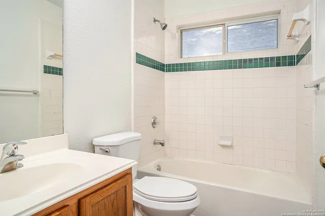 a bathroom with a sink a toilet and a bathtub