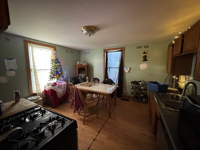 a living room with furniture a rug and a window