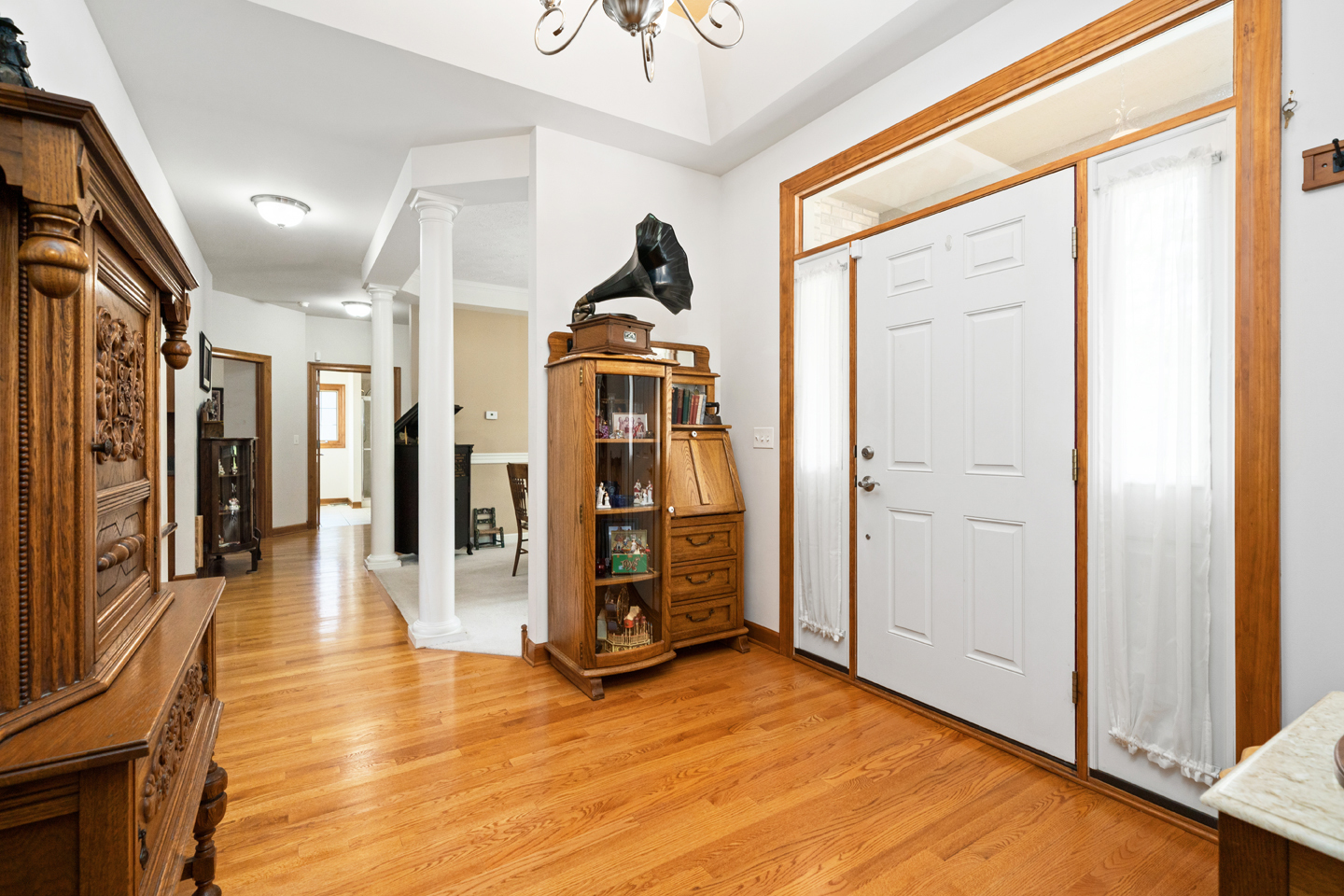 749 Merrill New Road Sugar Grove, IL 60554 - Photo 7 of 43 a view of a hallway with wooden floor and staircase
