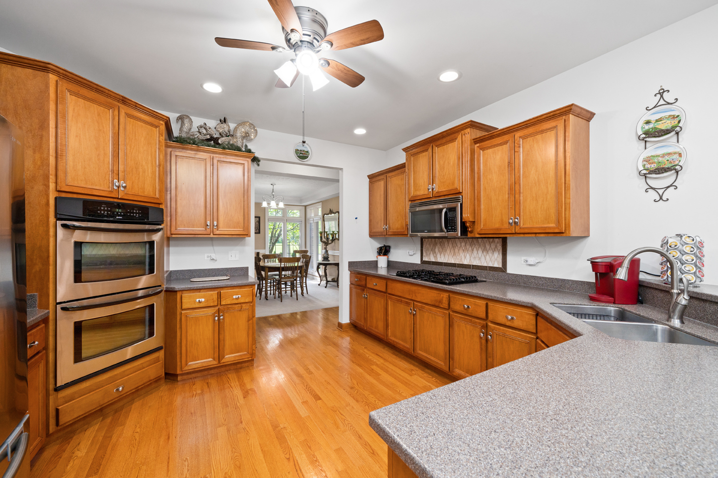 749 Merrill New Road Sugar Grove, IL 60554 - Photo 9 of 43 a kitchen with stainless steel appliances granite countertop a refrigerator a sink dishwasher stove and oven