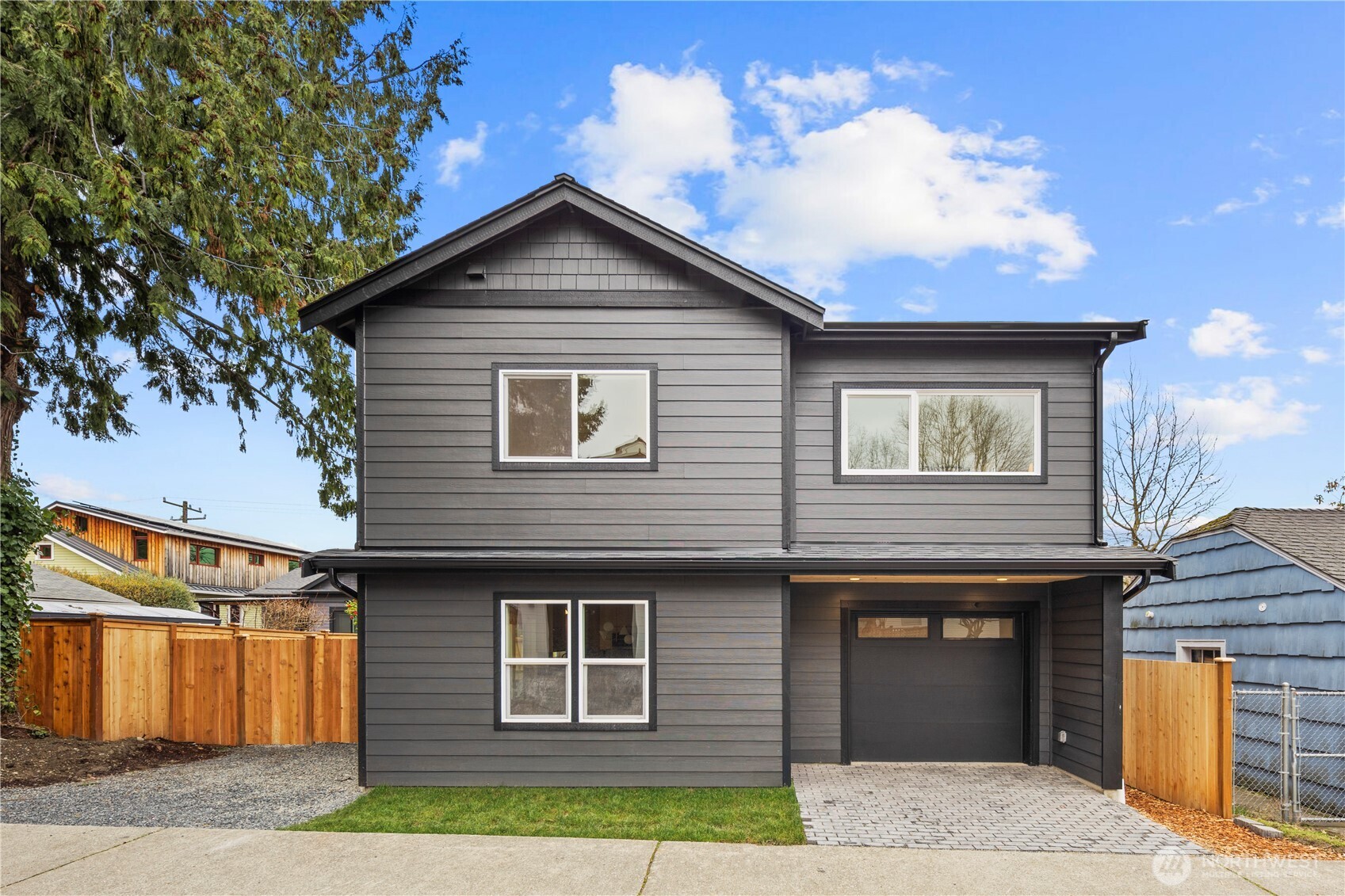 815 26th Avenue South, Unit B Seattle, WA 98144 - Photo 1 of 33 a front view of a house with a yard