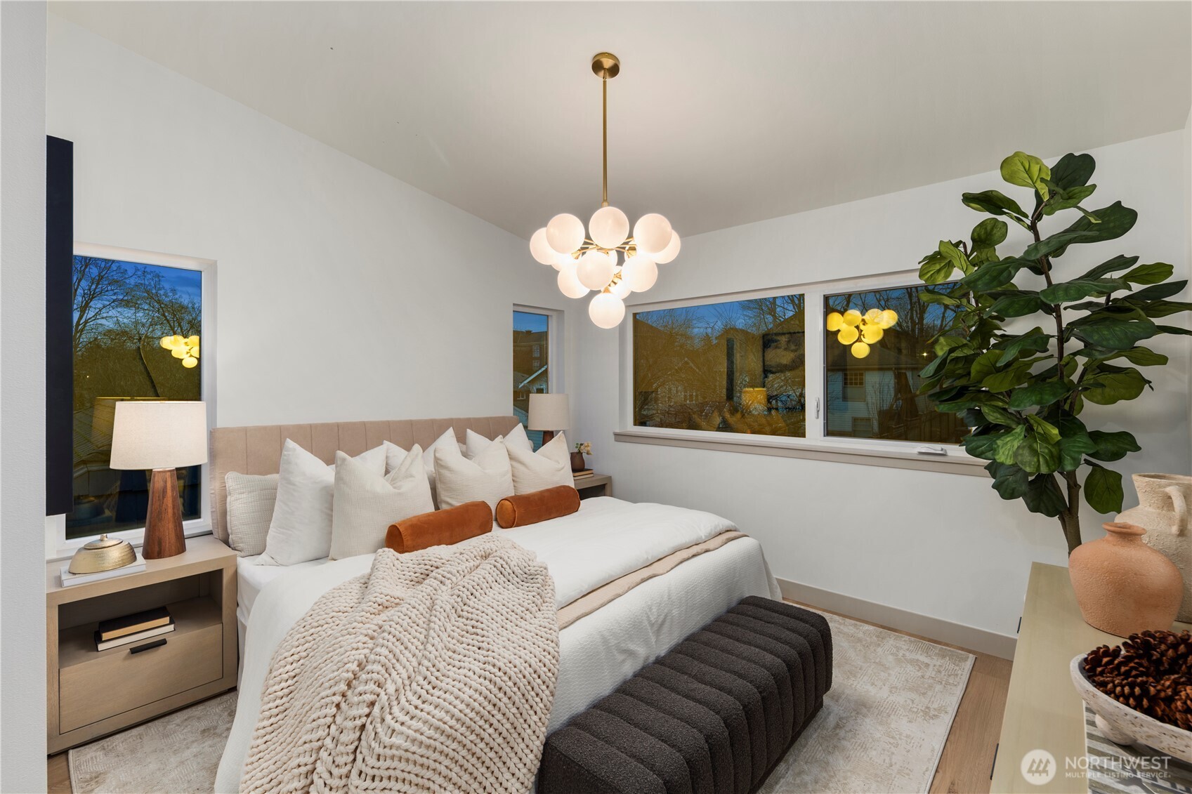 815 26th Avenue South, Unit B Seattle, WA 98144 - Photo 13 of 33 a bedroom with a bed and a chandelier