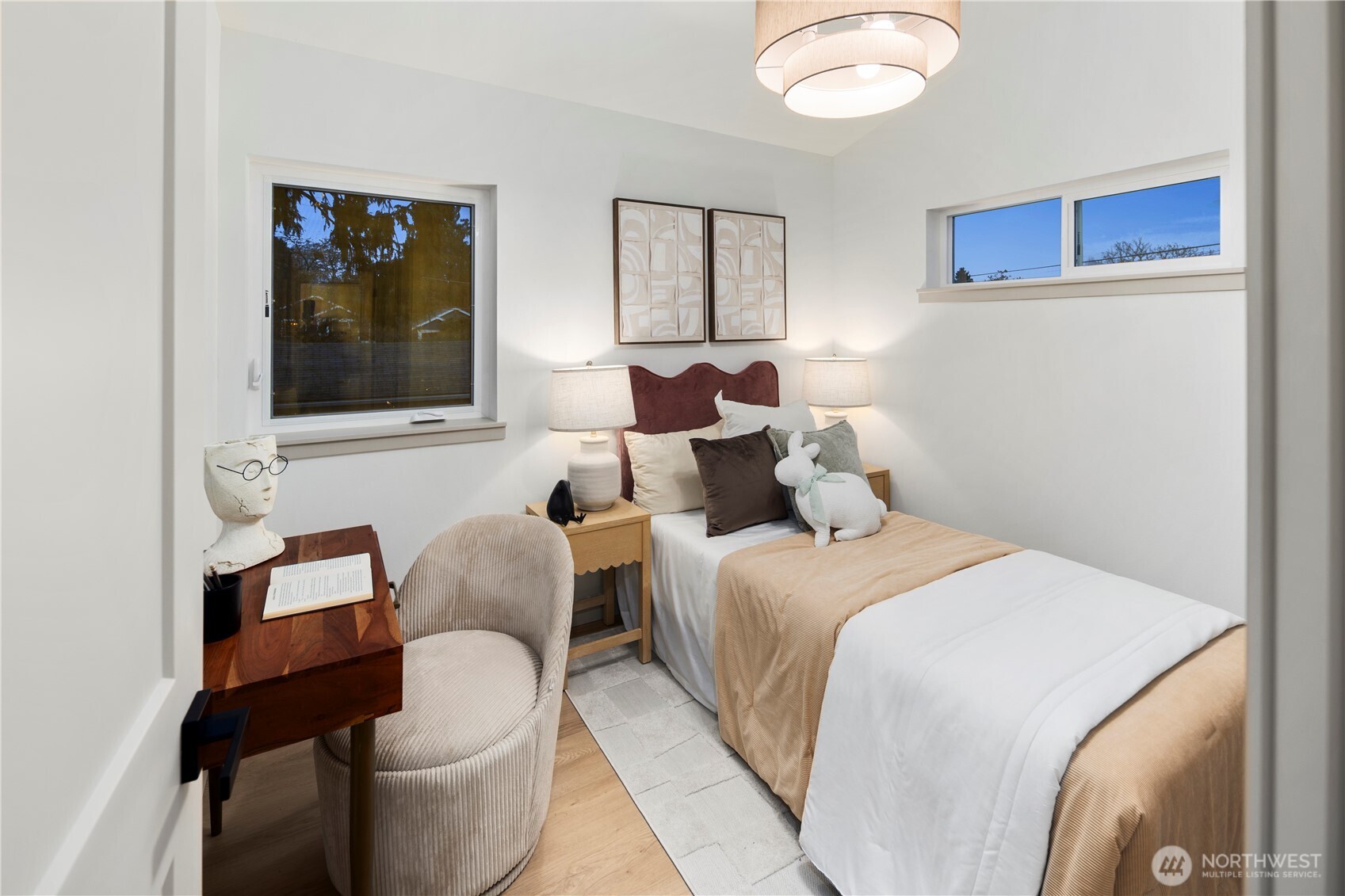 815 26th Avenue South, Unit B Seattle, WA 98144 - Photo 16 of 33 a bedroom with a bed and a painting on the wall