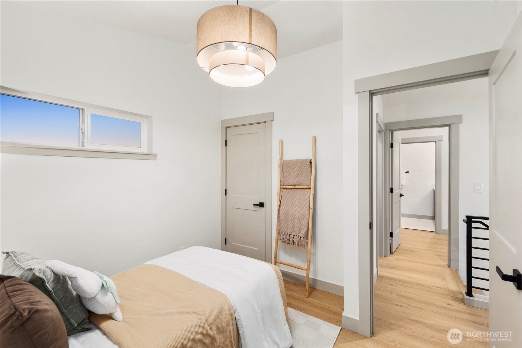 815 26th Avenue South, Unit B Seattle, WA 98144 - Photo 17 of 33 a bedroom with a bed and a chandelier