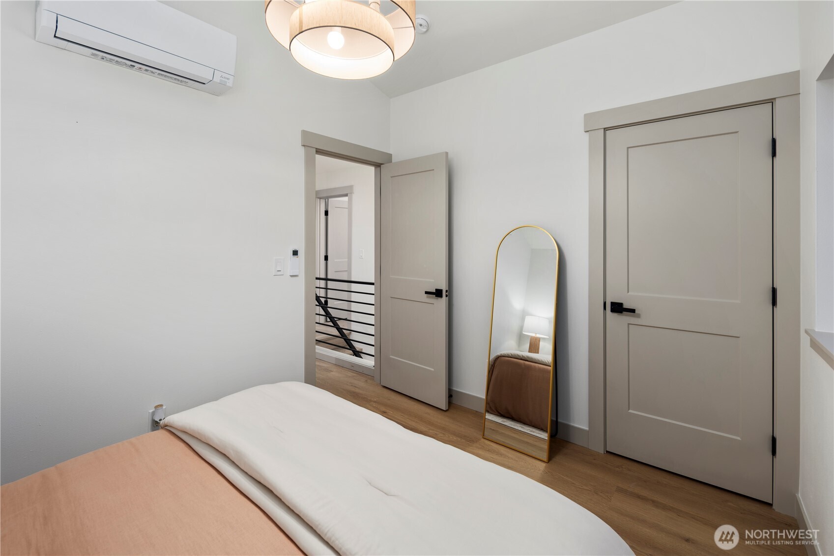 815 26th Avenue South, Unit B Seattle, WA 98144 - Photo 21 of 33 a bedroom with a bed and a potted plant