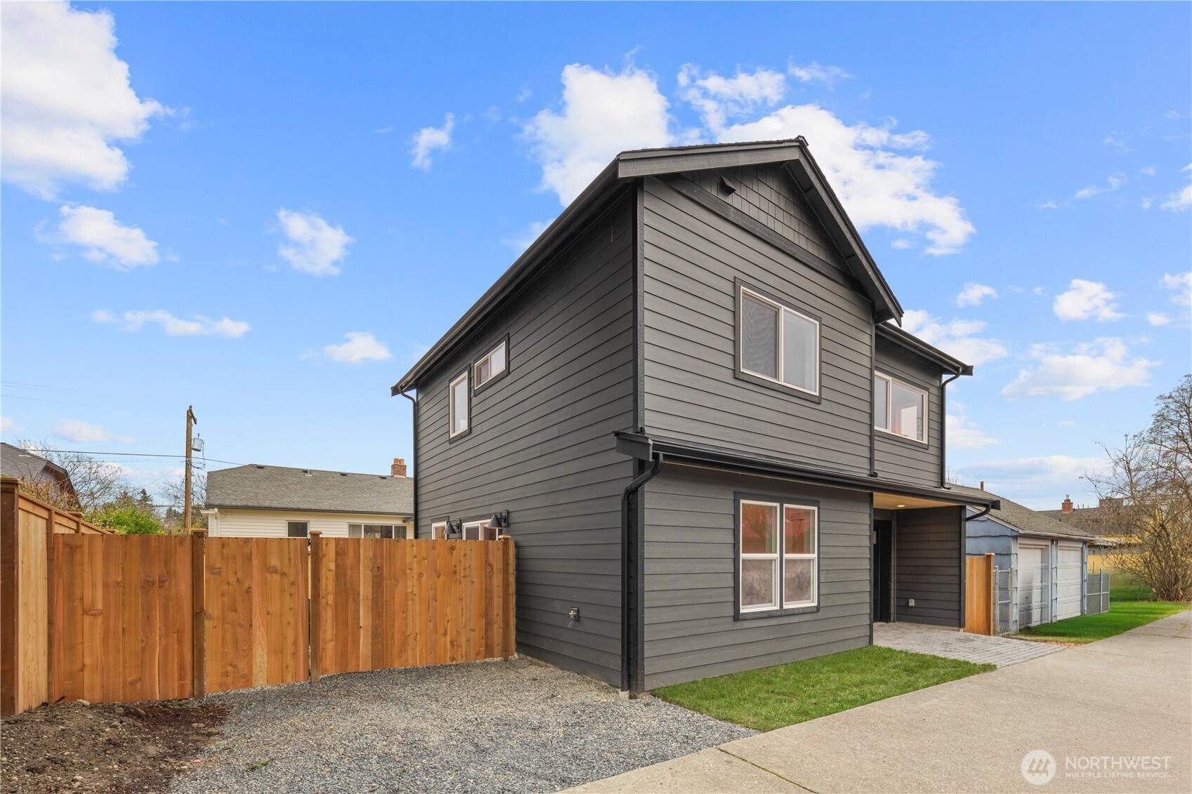 815 26th Avenue South, Unit B Seattle, WA 98144 - Photo 29 of 33 a front view of a house with a yard