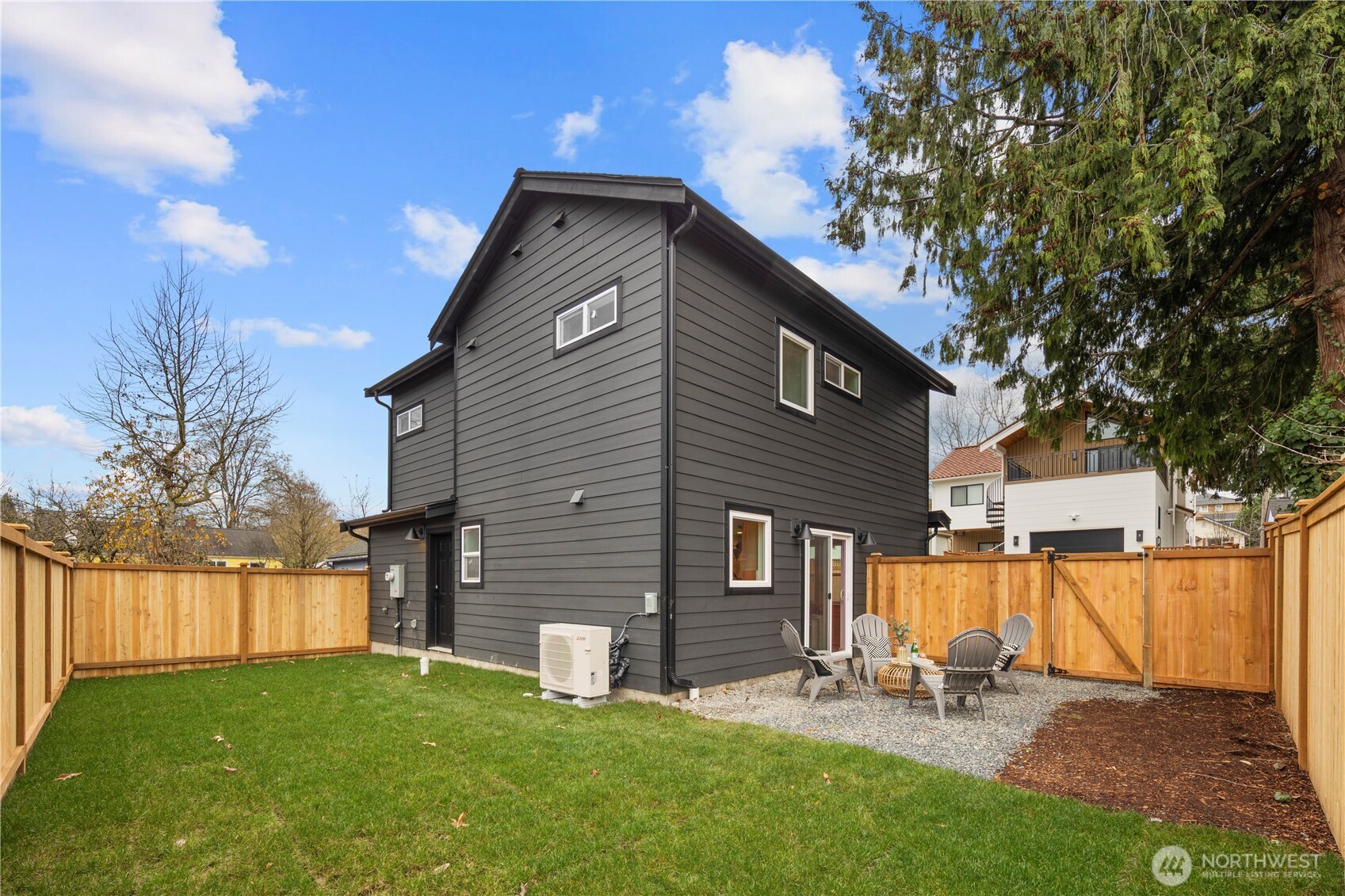 815 26th Avenue South, Unit B Seattle, WA 98144 - Photo 30 of 33 a backyard of a house with table and chairs