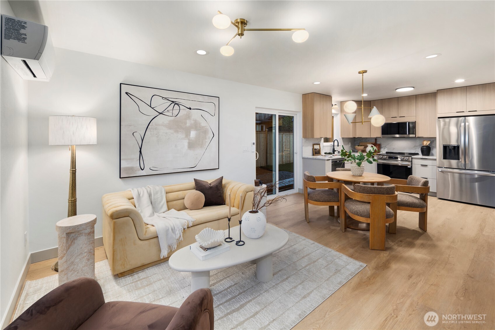 815 26th Avenue South, Unit B Seattle, WA 98144 - Photo 3 of 33 a living room with furniture kitchen view and a wooden floor