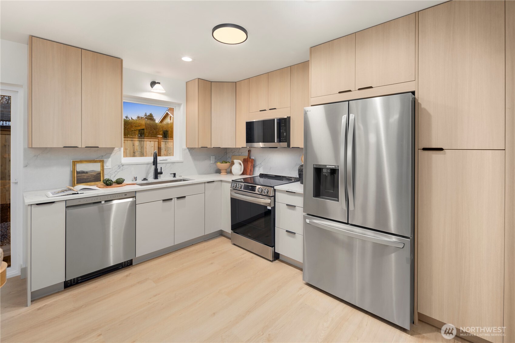 815 26th Avenue South, Unit B Seattle, WA 98144 - Photo 7 of 33 a kitchen with a refrigerator stove and sink