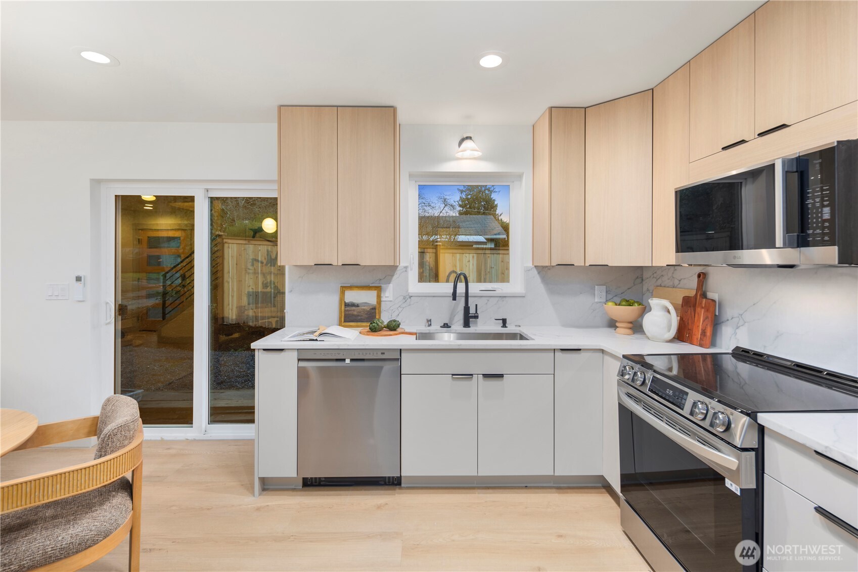815 26th Avenue South, Unit B Seattle, WA 98144 - Photo 8 of 33 a kitchen with a sink stove and cabinets