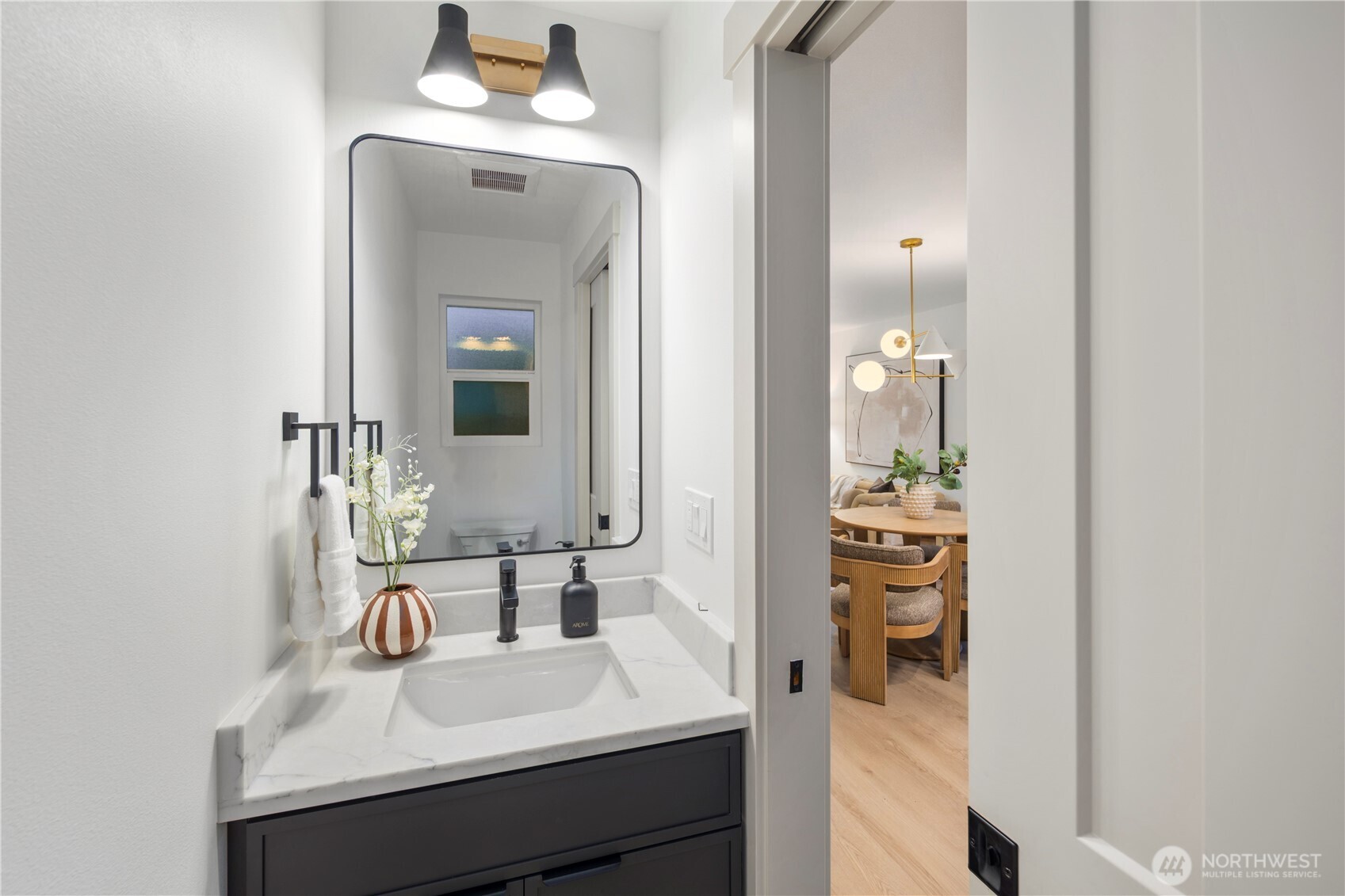 815 26th Avenue South, Unit B Seattle, WA 98144 - Photo 9 of 33 a en suite bathroom with a sink and a mirror