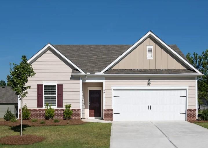 7350 Cranleigh Street Covington, GA 30014 - Photo 1 of 1 a front view of a house with garden