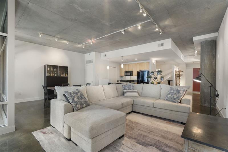 845 Spring Street Northwest, Unit 523 Atlanta, GA 30308 - Photo 12 of 21 a living room with furniture and a couch