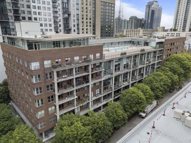 845 Spring Street Northwest, Unit 523 Atlanta, GA 30308 - Photo 2 of 21 a view of a building with a garden