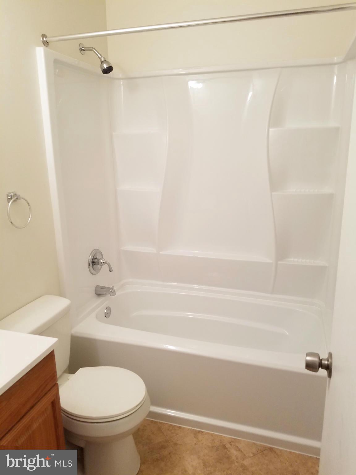 12908 Glynis Road Clinton, MD 20735 - Photo 15 of 30 a bathroom with a shower and a toilet