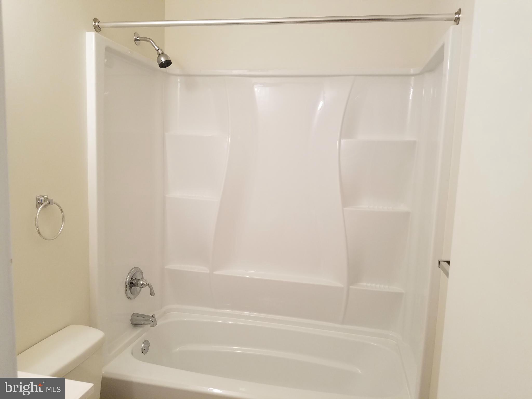 12908 Glynis Road Clinton, MD 20735 - Photo 16 of 30 a bathroom with a shower and a bath tub