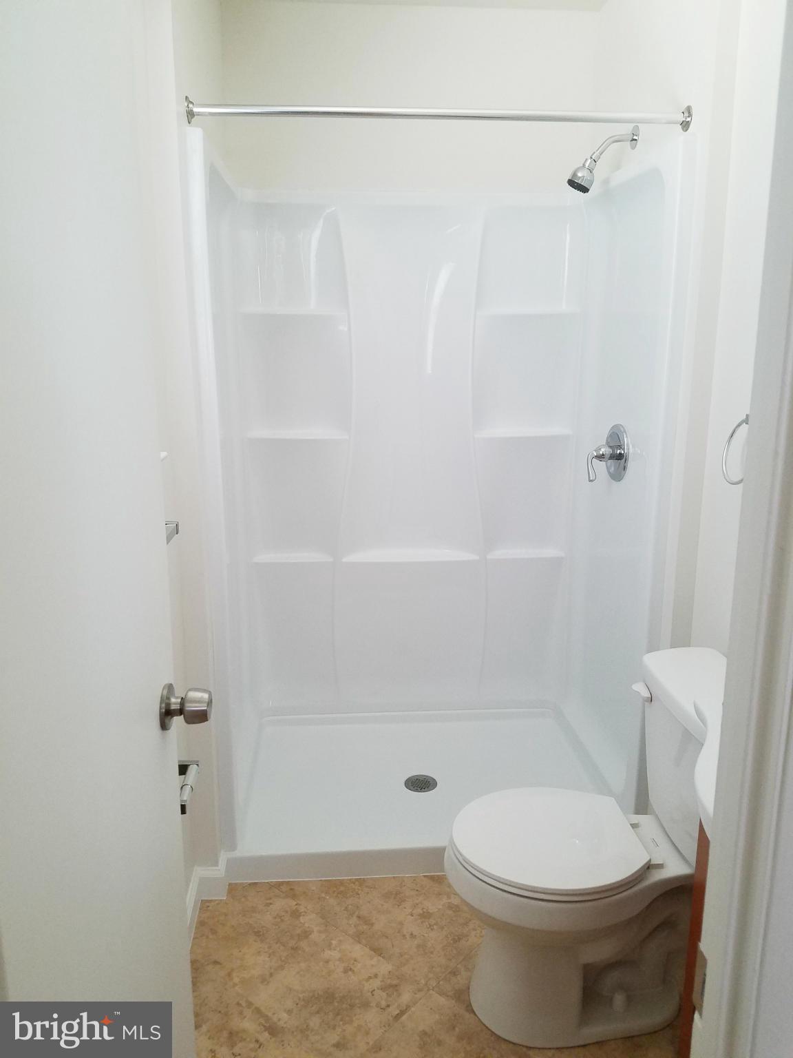 12908 Glynis Road Clinton, MD 20735 - Photo 19 of 30 a bathroom with a shower and a toilet