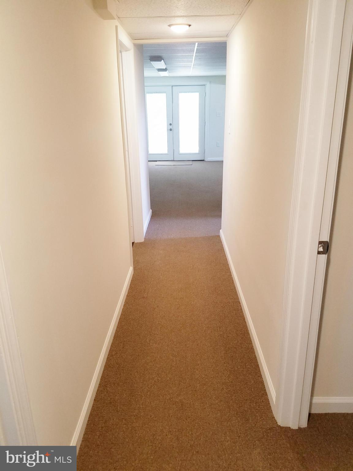 12908 Glynis Road Clinton, MD 20735 - Photo 23 of 30 a view of a hallway to a bedroom