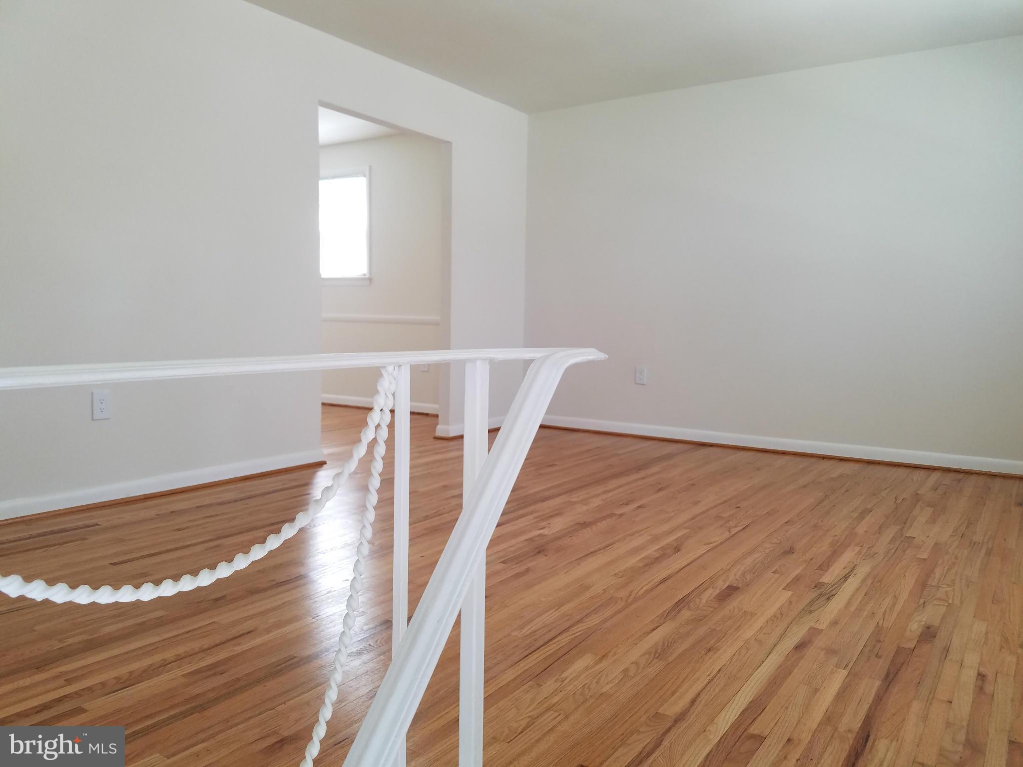 12908 Glynis Road Clinton, MD 20735 - Photo 8 of 30 a view of entryway with wooden floor