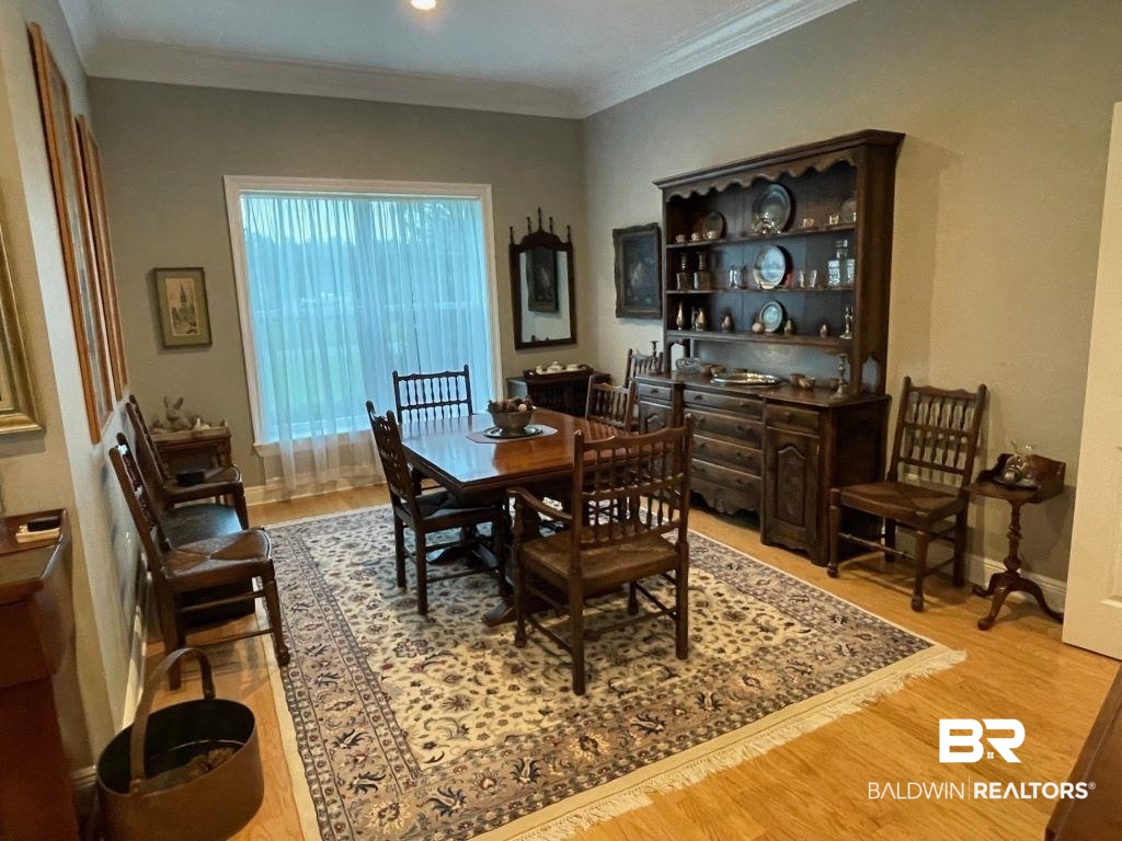 6426 East Quarry Drive Elberta, AL 36530 - Photo 4 of 19 Dining space featuring crown molding and light wood-type flooring