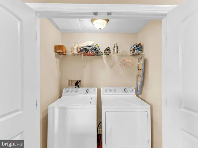 a kitchen with a sink stove top oven and cabinets