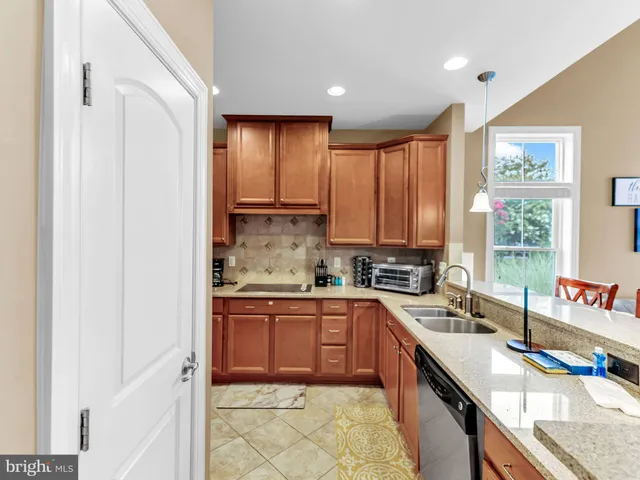a bedroom with furniture and a large window