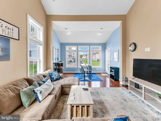 a view of a livingroom with furniture and a window