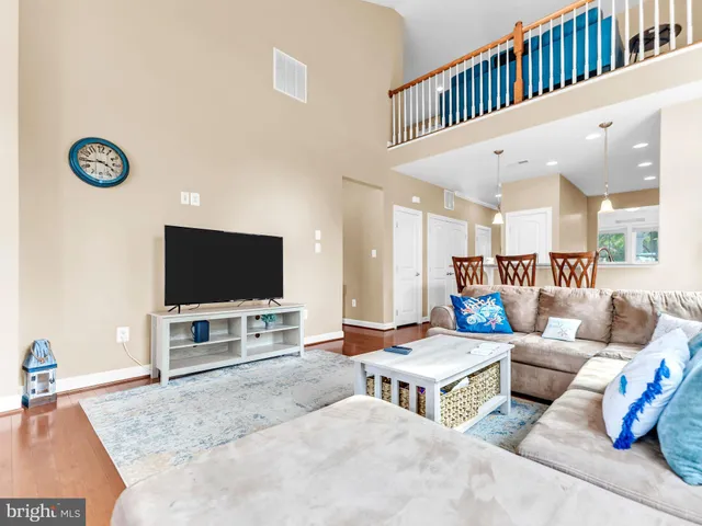 a bedroom with a bed and a television