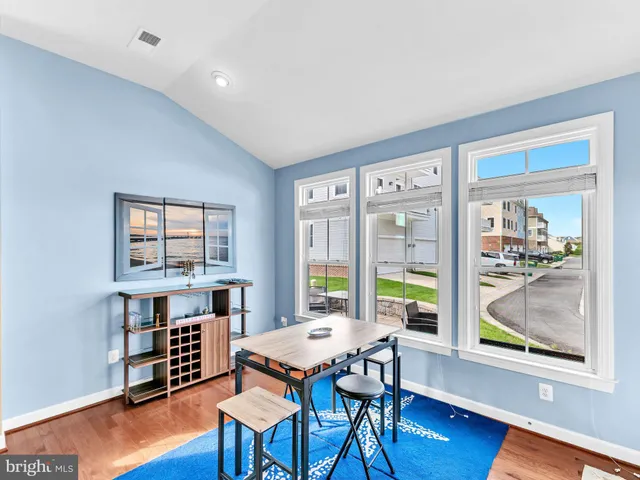 a bathroom with a sink vanity granite tub shower and a mirror