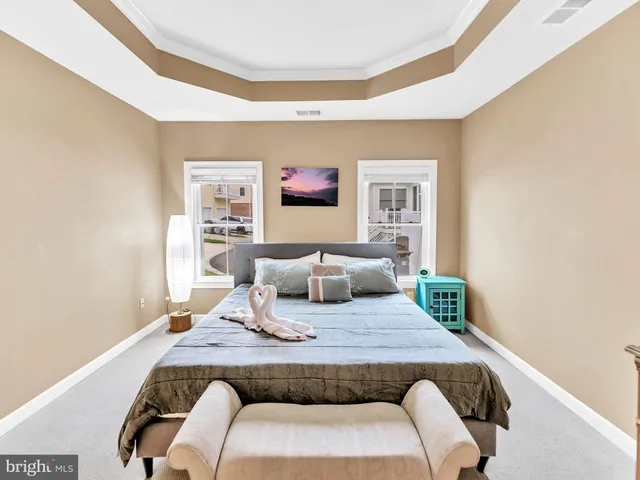 a room with a table and a bookshelf