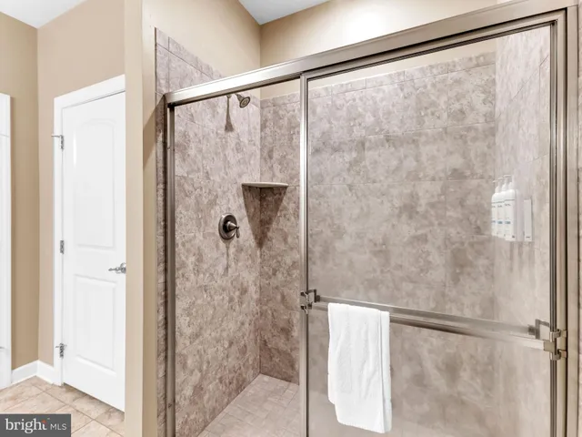 a bedroom with a bed and a closet