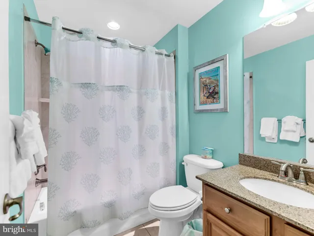 a view of a swimming pool and an outdoor seating