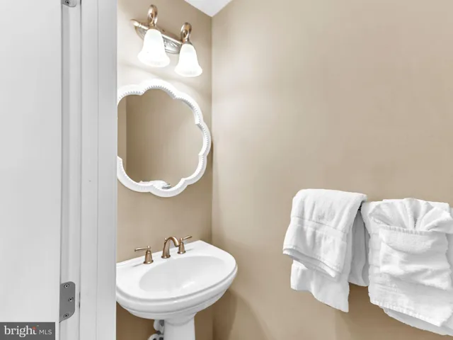 a kitchen with stainless steel appliances granite countertop a sink refrigerator and cabinets