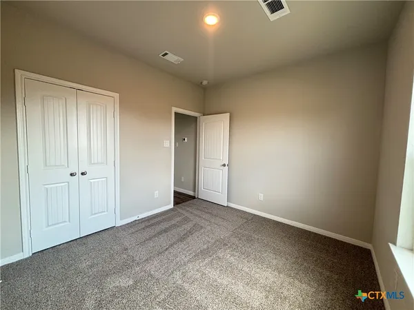 a view of hallway with closet